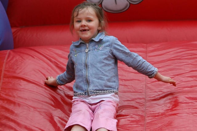 Lauren Carey has fun on the big slide at Toome Fair. AT16-301JC