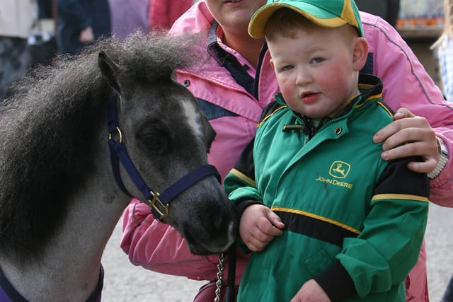 Jack Horner and his mum Jill with Tucker their Fabella pony, which is the world?s smallest breed of horse, were pictured at the Toome Horse Fair. AT16-306JC