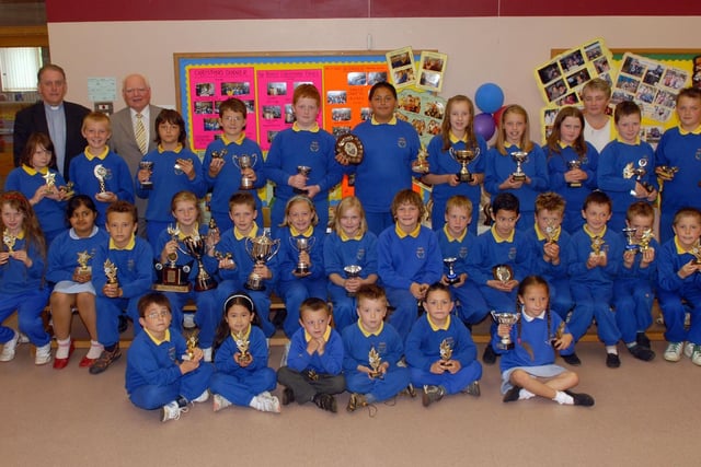The main prize winners at the Bleary Primary School end of year assembly in 2007 Included are Canon Brian Blacoe, vice chairman of the Board of Governors, Dr James McCammick, chairman and Mrs Joy Wilson, acting principal