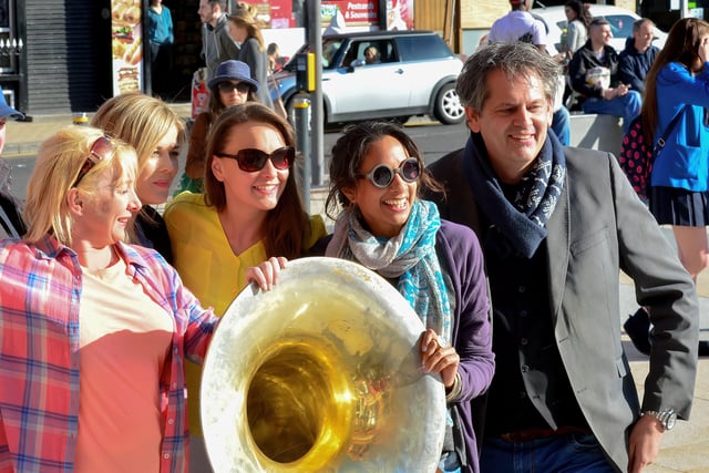 The Jaydee Brass Band's Patrick Witberg poses with fans for photos during the 2015 City of Derry Jazz Festival. Photo: George Sweeney / Derry Journal.