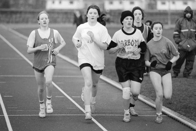 Young athletes make their way round the Templemore track during the Ulster Indoor Championships.