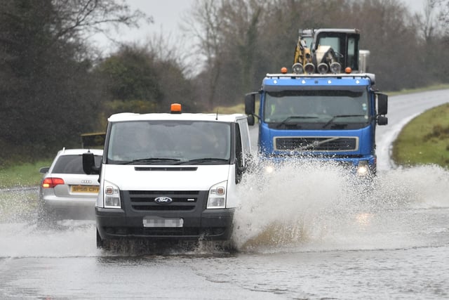 PACEMAKER BELFAST 03/02/2021 
Motorists Struggle threw the floods on the Moira Road on Wednesday as heavy rain falls across parts of N Ireland.
Pic Pacemaker