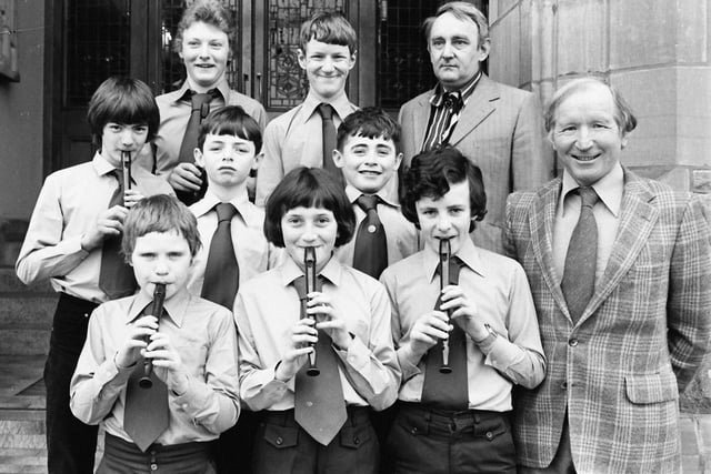 1980... Belmont House School, Derry, winners of the junior bands section at Londonderry Feis. On right are Tom Roulston, principal, and Noel Miller, conductor.