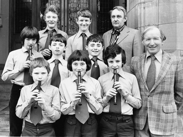 1980... Belmont House School, Derry, winners of the junior bands section at Londonderry Feis. On right are Tom Roulston, principal, and Noel Miller, conductor.