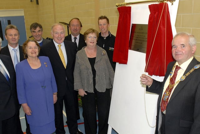 Mayor of Armagh, Charlie Rollston, unveils the plaque at the official opening of Richhill Recreation Centre in 2008 watched by some of the special guests who were invited to the event