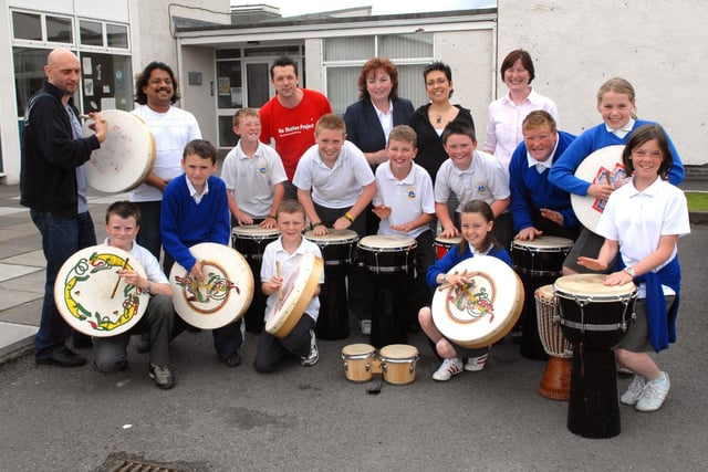 Children from St Mary's Primary School, Derrytrasna made some noise at the music workshop organised by the South Lough Neagh Regeneration Association in 2008. Included are musicians Davy Bates, Zhenia Mahdi-Nau, Darren Ferguson, Ganesh Kamble, school principal Mrs Joan Aldridge and Councillor Mary McAlinden, development officer for the SLNRA
