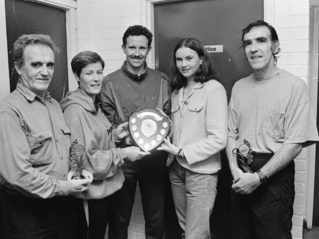 ‘Miss Creggan’ Leanne Cunningham (second from right) presents Rose Quigley with her trophy for winning the veteran ladies’ event at the Creggan Festival 3K road race. Included, from left, are Richard Dooley, over 50s winner, Maclcolm McCausland, over 40s winner and Seamus McElhinney, over 45s winner.