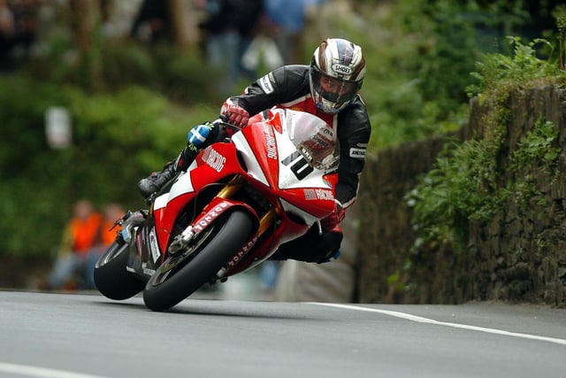 John McGuinness made it a Superbike and Senior double as he capped race week in 2005 with victory in the prestigious Senior TT on the AIM Yamaha, beating Ian Lougher and Guy Martin.