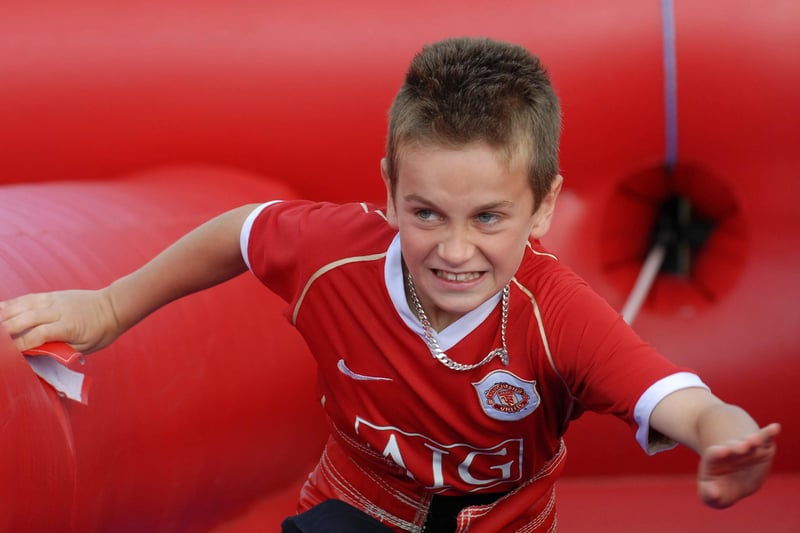 Determination on the face of young Cameron Nutt as he takes part in the "Bungee Run" at the Ebrington Primary School Summer Fete. LS26-157KM