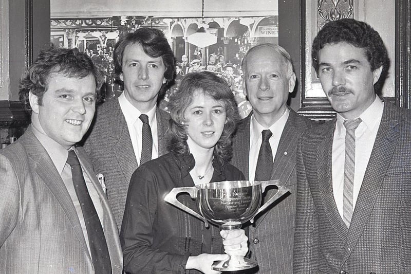Ulster business interests were urged to take part in the annual Irish Management Game in January 1982. In 1981 the Ulster champion, Bass (Ireland), came third in the national final of the computer, based business game. Pictured is Mr Jim Crossen, second from right, administrator of the Irish Management Game, with the present Ulster champion, Bass Ireland, when details were announced of the 1982 compeititon. Team members were, fro, left, Brian Houston, Gordon Cleland, Sheena McLaughlin and captain, Charles McCambridge. Picture: News Letter archives