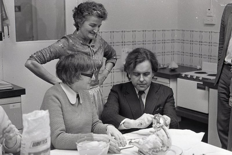 Minister John Patten got an idea of problems facing the blind when he tried to peel potatoes with his eyes closed. With him are Mrs Henrieyya Todd and cookery instructor Magdaline Torr. Picture: News Letter archives