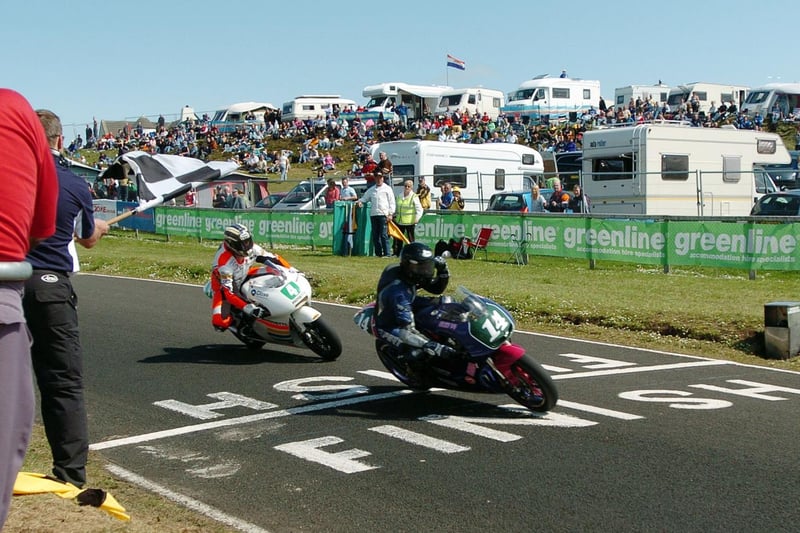 Christian Elkin edged out John McGuinness to win the 250cc race.