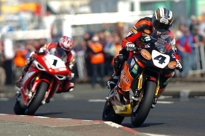 John McGuinness (HM Plant Honda) leads the opening Superbike race at the 2007 North West 200 from Steve Plater (AIM Yamaha).