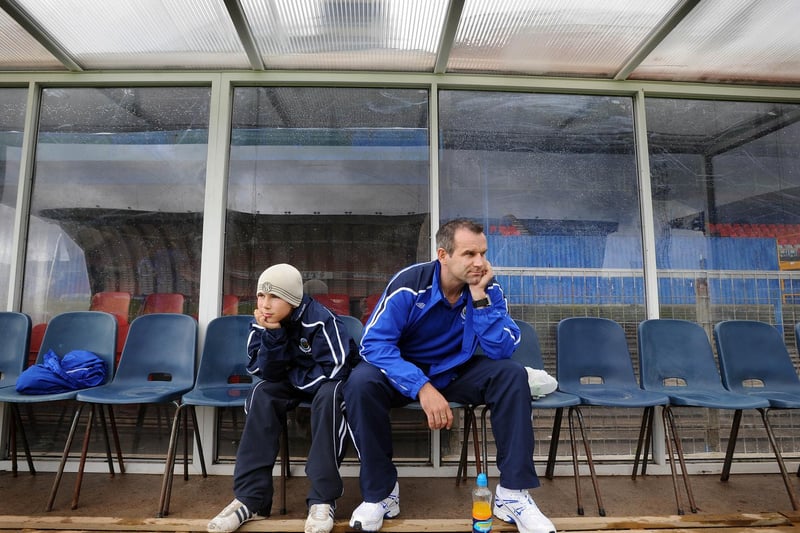 Glenn Ferguson and his son Matthew watch team training at Windsor Park as the opening round of fixtures was postponed due to a referees' strike