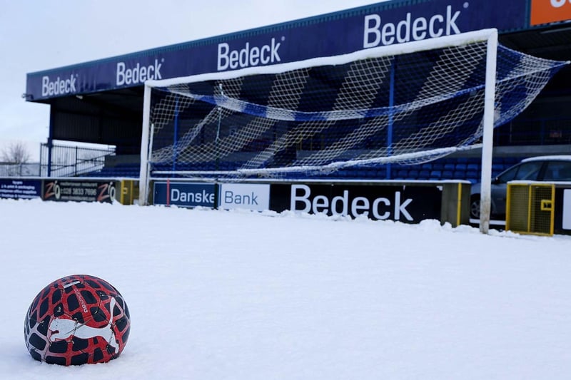 Heavy snow covers the pitch at Mourneview Park