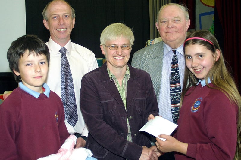Ampertaine Primary School pupil Ruth Kempton presents Dr. Maureen Stevenson with a cheque for £325 which was raised by the parents and children before Easter. Also in the photograph is Principal Mr Garry McIlwaine Mr. Alfie Lee, (Board of Governors) and pupil Stephen Kissick.mm2207-207ar.