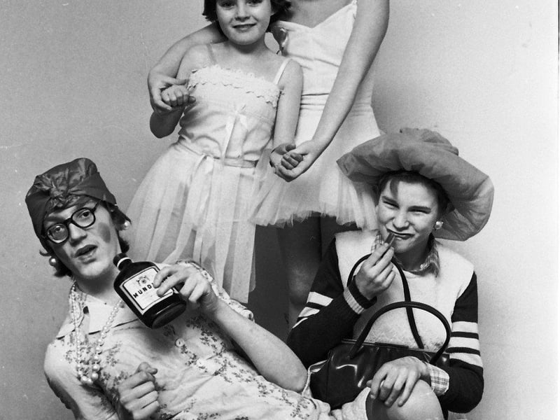 February 1980... Comedy duo Rodney Ferguson (Laxative Lucy) and Liam Costello (Lily Orr) in typical pose pictured with Karen O'Doherty and Natalie Mallett, as ballerinas, who took part in the Waterside Youth Club variety show.