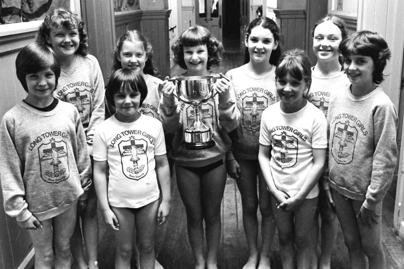 June 1981... St Columba's Girls PS, Long Tower, winners of the NW Schools' Swimming Association (primary schools section) at the annual gala. From left are Gina Doherty, Edel Rankin, Martina Casey, Brenda Moore, Stephanie Wood, Marie Matthewson, Sandra Doherty, Joanne McConnell and Carmel McConnellogue.