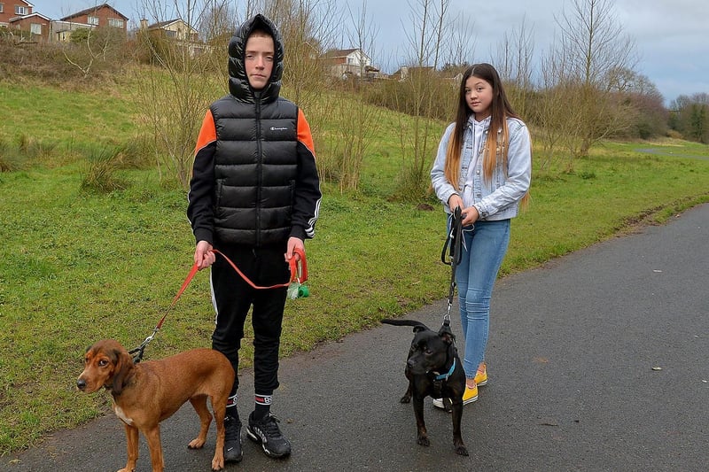 Enjoying some exercise in the Bay Road Park recently are Cormac Gillespie with Rosie and Sophia Smith with Kilo. DER2105GS – 027