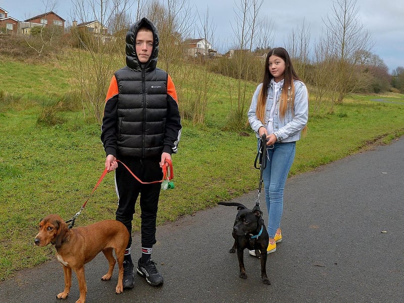 Enjoying some exercise in the Bay Road Park recently are Cormac Gillespie with Rosie and Sophia Smith with Kilo. DER2105GS – 027