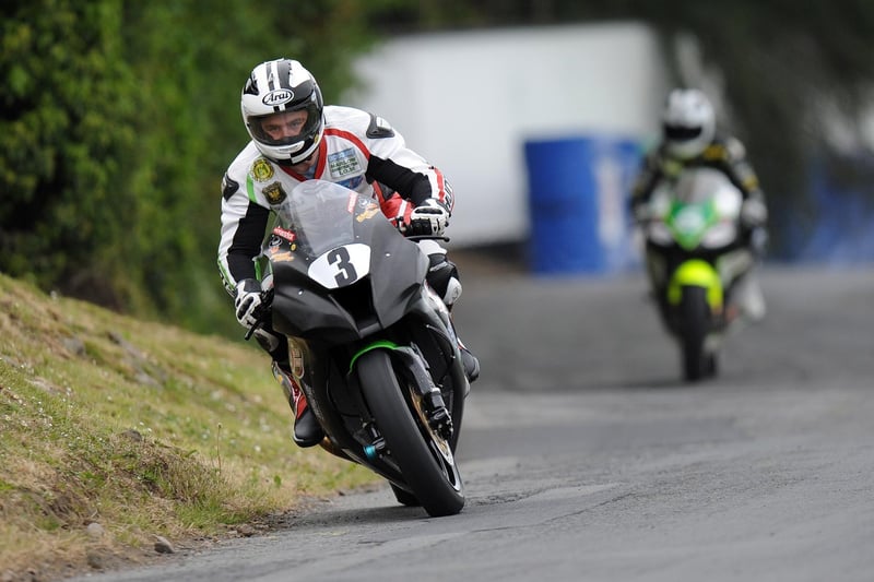 Michael Dunlop gets the Paul Bird Motorsport-built Kawasaki ZX-10 Superbike all crossed up during practice for the 2011 Tandragee 100 as brother William gets a grandstand view of the 'moment'.