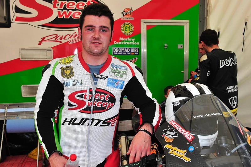 Michael Dunlop clinched a double with hard-earned victories in the Superbike and Supersport races.