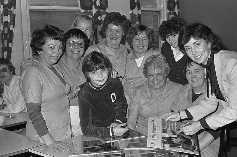 Country music star Ann Breen from Downpatrick authographs copies of her latest album for canteen staff during her visit to Belfast's Mater Hospital when she broadcast to patients and staff over the hospital radio in February 1982. Picture: News Letter archives