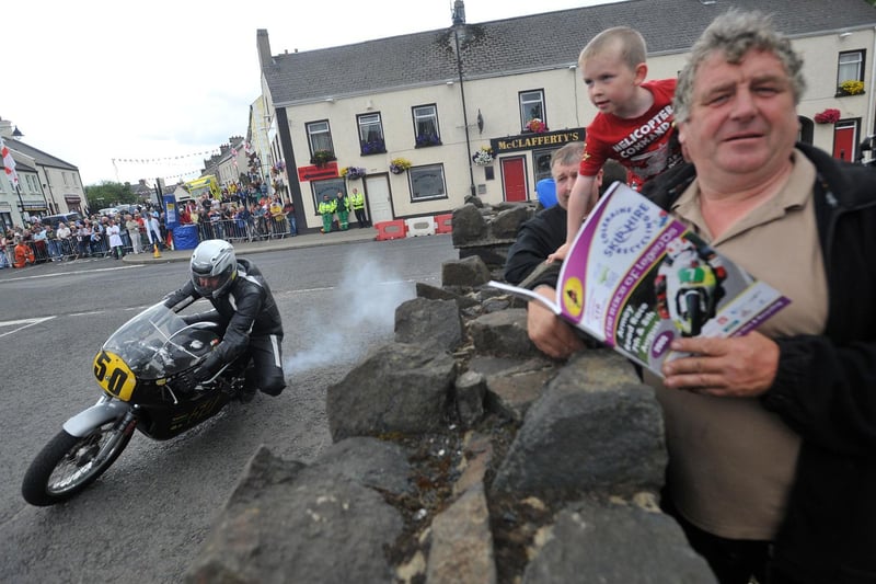 Locals watch Newtownabbey's Gary Jamison in Armoy village during practice for the inaugural meeting in 2009.