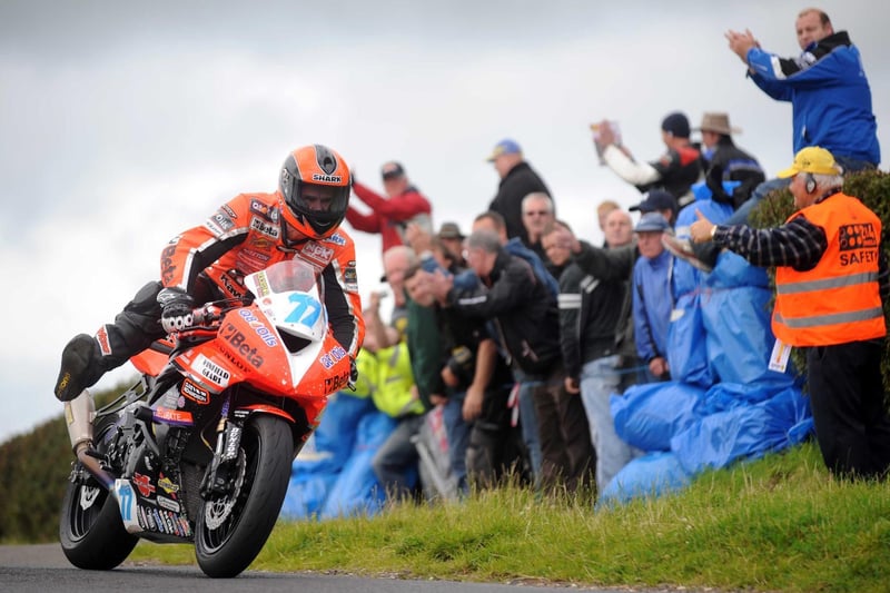 Ryan Farquhar acknowledges the fans after bagging a hat-trick at the 2009 Armoy road races and establishing the outright lap record at 107.897mph for the three-mile course.