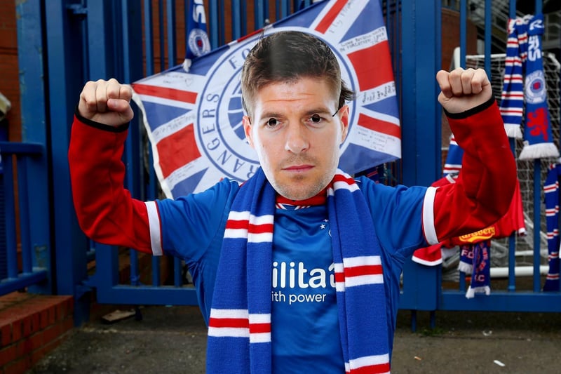 A Rangers fan wears a Steven Gerrard mask outside of the Ibrox Stadium