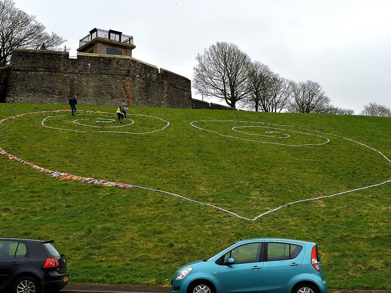 Completing some artwork in the Bogside to celebrate St Patrick’s Day. DER2110GS – 012