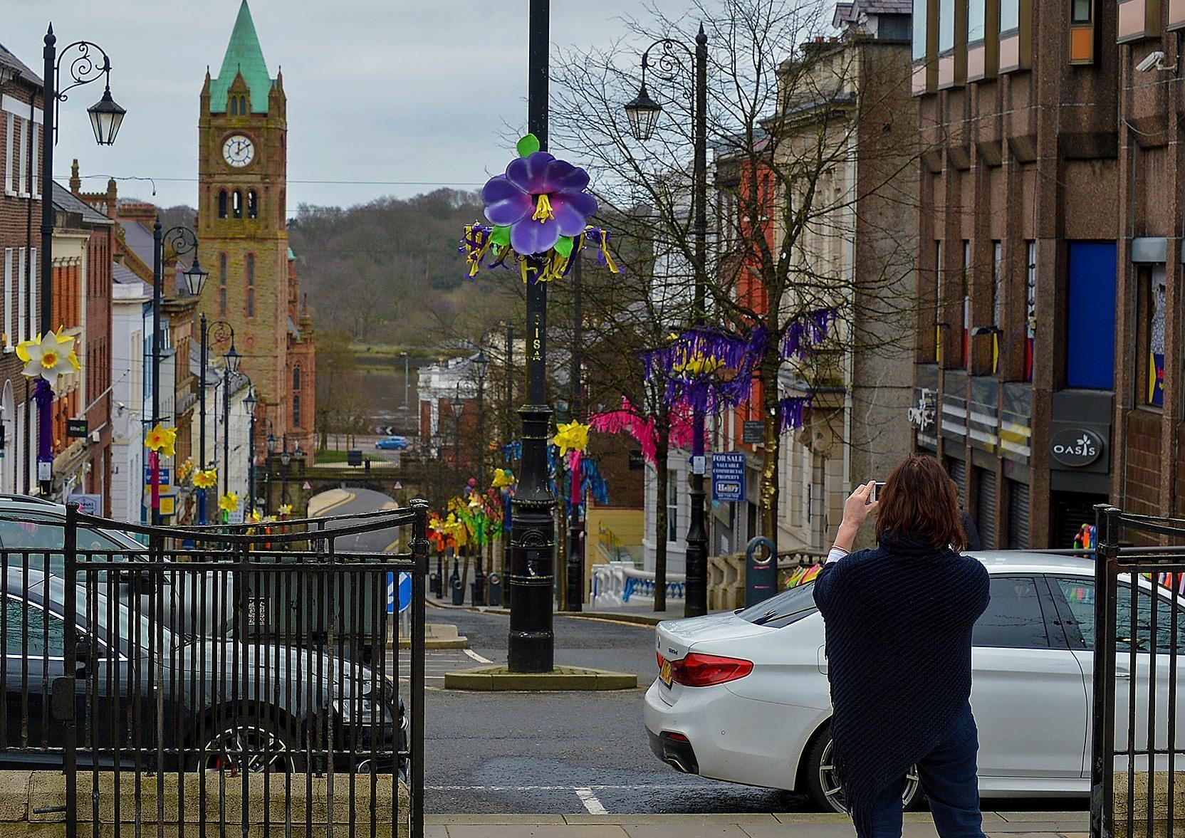 Taking a snap of a colourful Shipquay Street to celebrating St Patrick’s Day. DER2110GS – 009