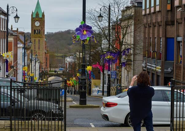Taking a snap of a colourful Shipquay Street to celebrating St Patrick’s Day. DER2110GS – 009
