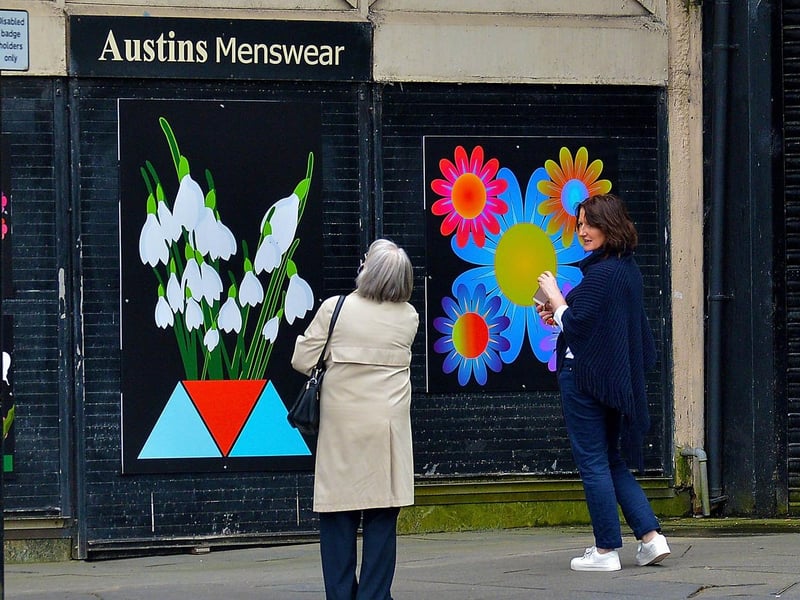 People admire the artwork Diamond  area created to celebrate St Patrick’s Day. DER2110GS – 011