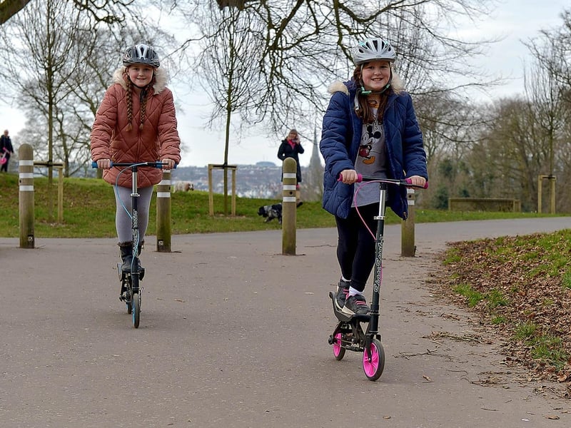 Elora Thompson, aged 9, and her sister Aerith (10) exercise on their scooters during a recent visit to St Columb’s Park. DER2109GS – 018