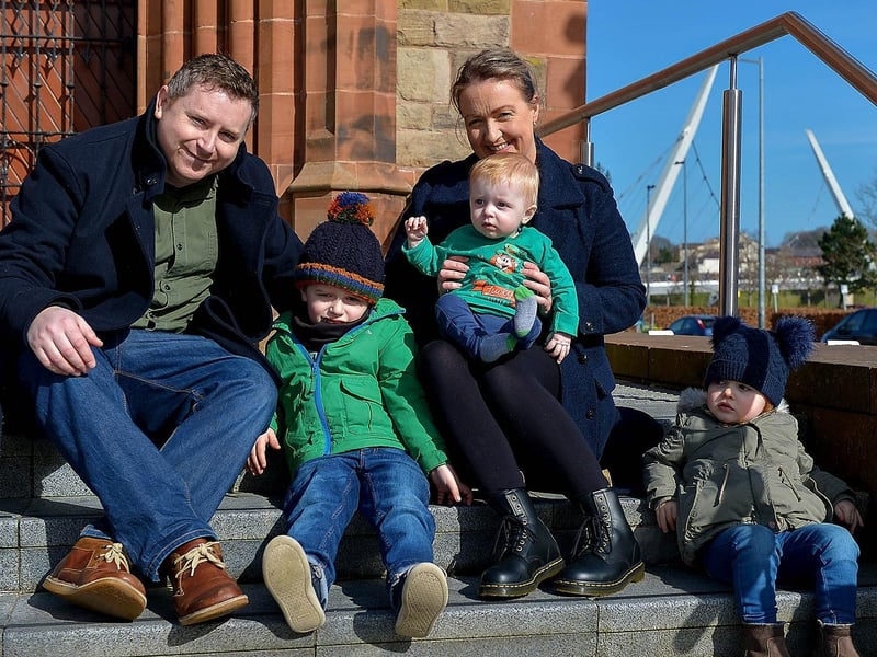 Eamonn and Lynda Lynch enjoy the St Patrick’s Day sunshine in Guildhall Square with their children Conor, Malachy and Orlaith. DER2110GS – 021