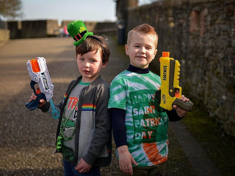 Cousins Aodhan Gillespie, aged 5, and Brandain Crossan (6) walked around Derry Walls on St Patrick’s Day. Photos: George Sweeney / Derry Journal. DER2110GS – 024