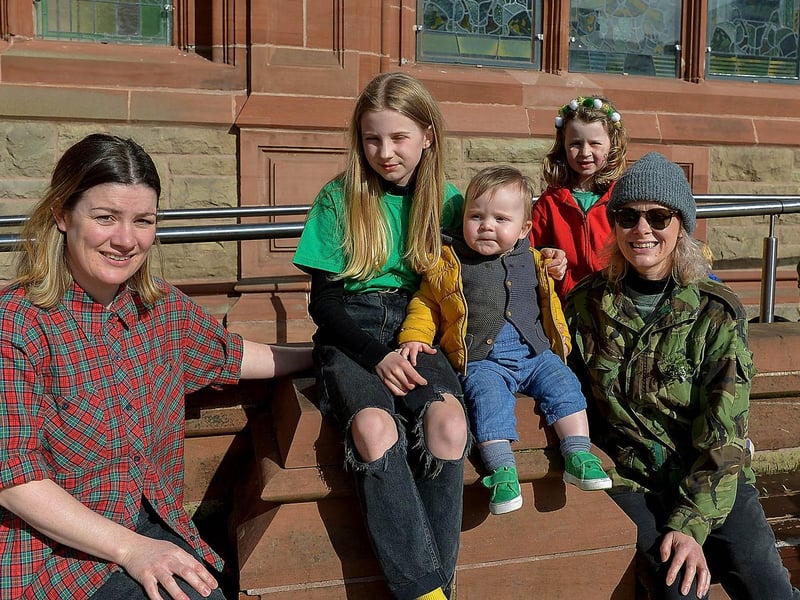 The McNabb family bubble enjoys the St Patrick’s Day sunshine in Guildhall Square. DER2110GS – 026