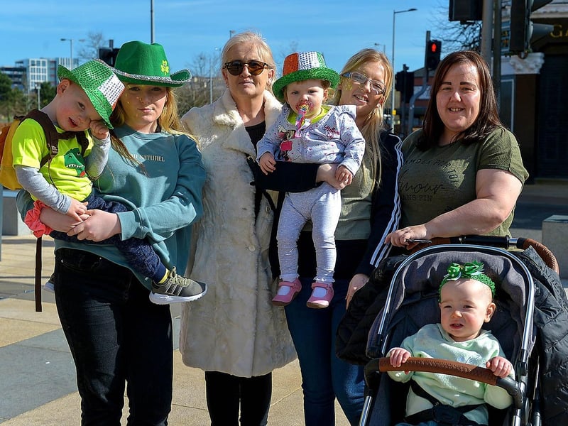 The Sweeney family bubble take in the St Patrick's Day sunshine in Guildhall Square. DER2110GS – 027