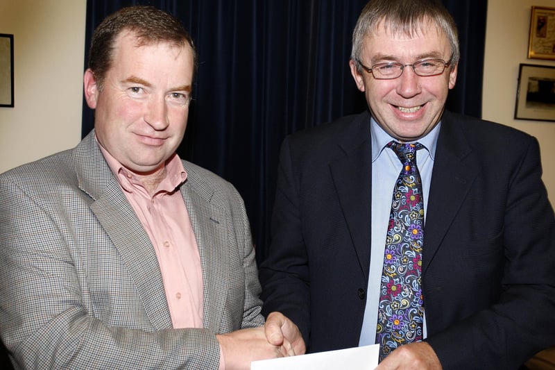 Dr. John Kerr, Garvagh Health Centre, is presented with a £600 cheque from Glenn Stewart during the Garvagh Clydesdale and Vintage Vehicle Club presentation evening. CR47-150PL