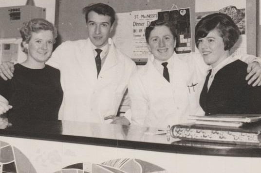 Behind the reception desk in the King's Arms Hotel in 1967-68.   Anna ? (receptionist),  John Bell, waiter / porter,  Frank Cosgrove (?) and  restaurant waitress Sinead.
Gareth Jones recalls that Sinead knitted superb Aran jumpers and cardigans. 
"My father had his for many, many years. He used it when he was working in the cellar of our pub in Wales and said it was like wearing a blanket. He wore it for so many years and was heartbroken when it eventually wore out!" said Gareth.