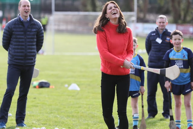 The Duke and Duchess of Cambridge try out hurling during a visit to a local Gaelic Athletic Association (GAA) club to learn more about traditional sports during the third day of their visit to the Republic of Ireland