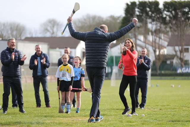 The Duke and Duchess of Cambridge try hurling during a visit to Salthill Knocknacarra GAA Club in Galway