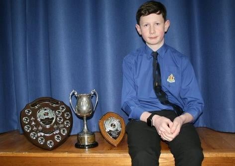Tom Kirkpatrick with his Trophies for Scripture, Uniform and Sporting