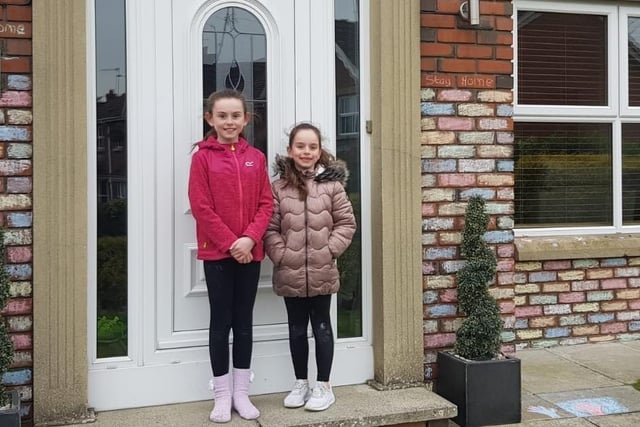 Hannah and Emily Willis decided to paint the bricks of their house to brighten up the street