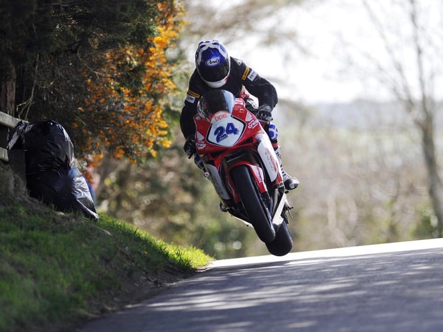 Hard-riding Scot Keith Amor set a new lap record as he won the Supersport race on the Wilson Craig Racing Honda.