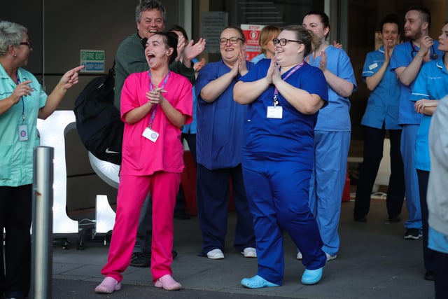 Staff outside Belfast City Hospital's tower block, which is Northern Ireland's first Nightingale Hospital, hold a short event at 8.00pm to recognise and acknowledge the public support during a Clap for Blue Light Services
