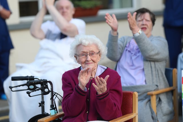 Residents and the healthcare staff at Towell House in Belfast sing a long to Vera Lynn's song 'We Will Meet Again' as they took part in the applause for the NHS at the Belfast residence