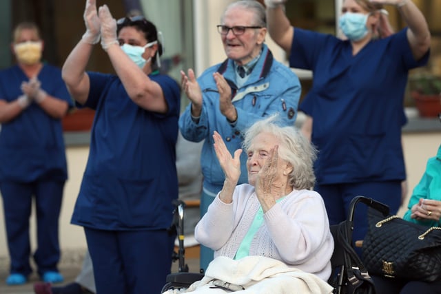 Residents and the healthcare staff at Towell House in Belfast sing a long to Vera Lynn's song 'We Will Meet Again' as they took part in the applause for the NHS at the Belfast residence