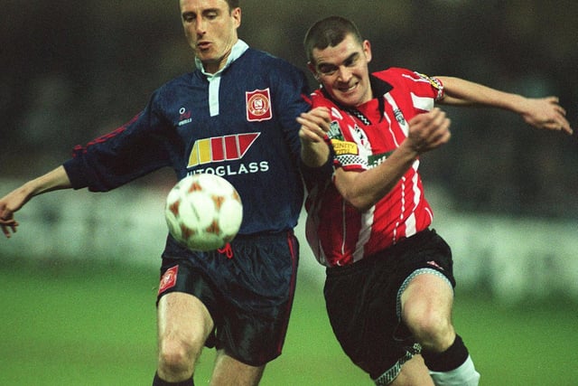 St Pat's Paul Campbell tussles with Derry City defender Sean Hargan at the Brandywell as the Candy Stripes closed in on the title.